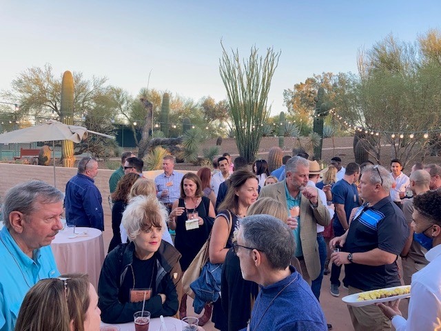 Conference attendees enjoy the beautiful ranch setting during the welcome reception.