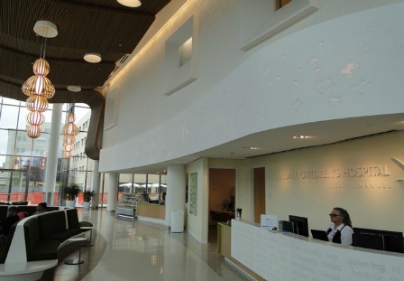 Figure 1 – One aspect of this massive project was to create a focal point of the hospital lobby in the form of a 240-ft.-long by 5-ft.-tall Art Frieze Ribbon suspended 14 ft. in the air.