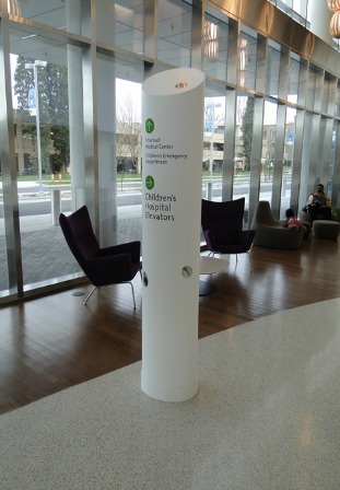 Figure 5 – Numerous 8-ft-high hourglass shaped cylindrical way-finding pillars were created from solid surface for the project. They were thermoformed in two pieces and then joined on site.